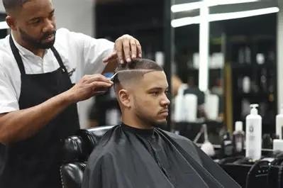 Barber giving a precision haircut