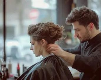 Hair stylist working on a client's updo